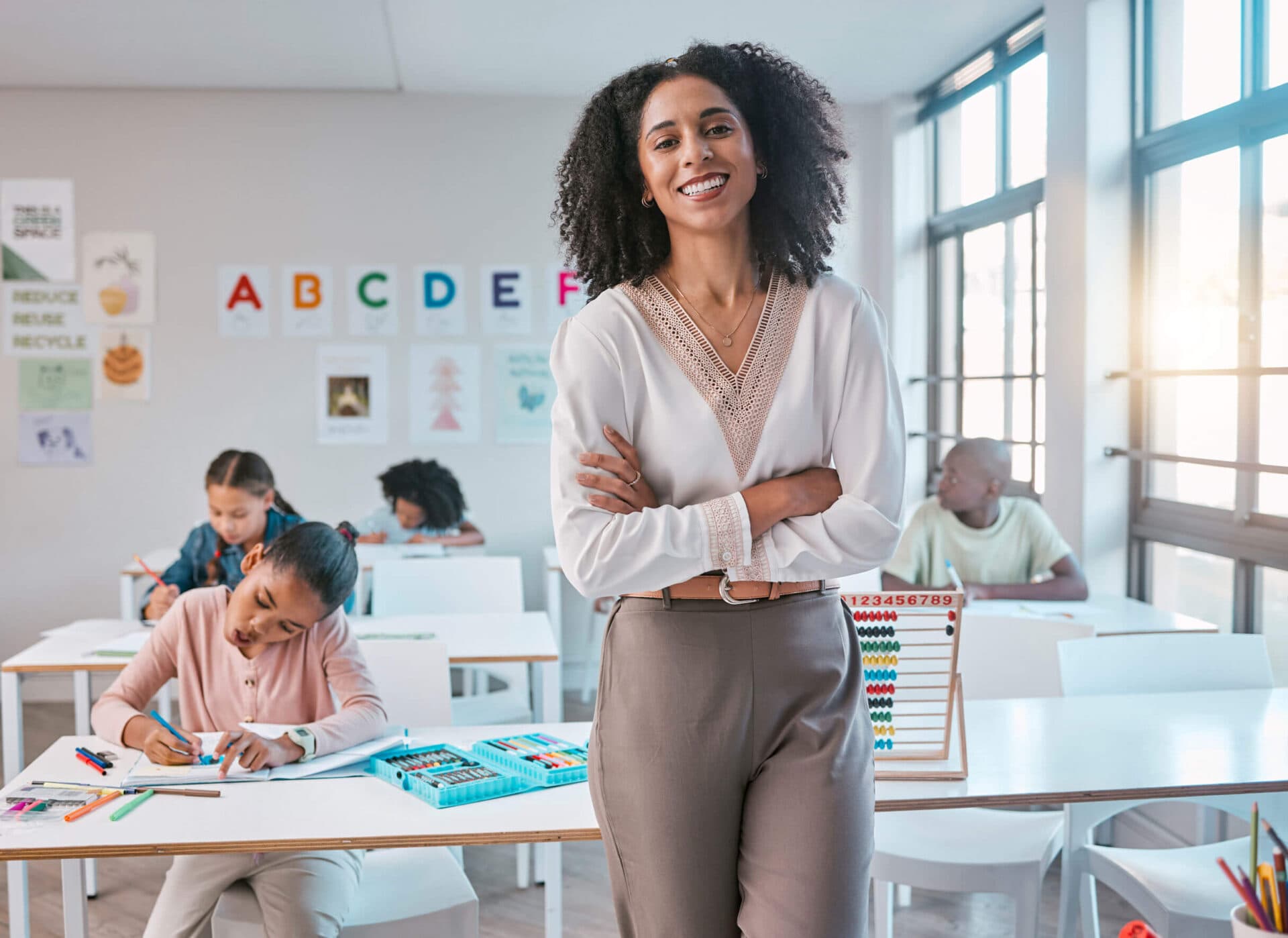 A Creative Playrooms teacher standing in her classroom